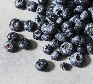 blueberries scattered on a table