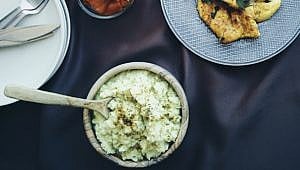 bowl of mashed cauliflower on a table