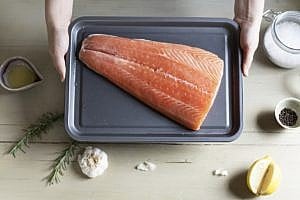 Raw salmon on a tray